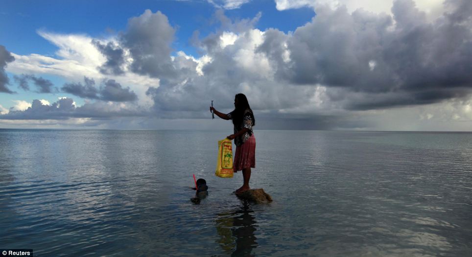 Bikeman islet in Kiribati has essentially disappeared below the waves. Photo by Reuters.