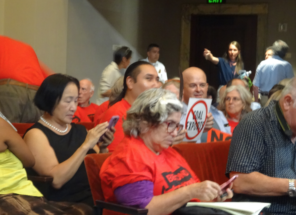 Former Mayor Jean Quan sits with opponents to the coal export plan (Photo by Darwin Bondgraham, East Bay Express)