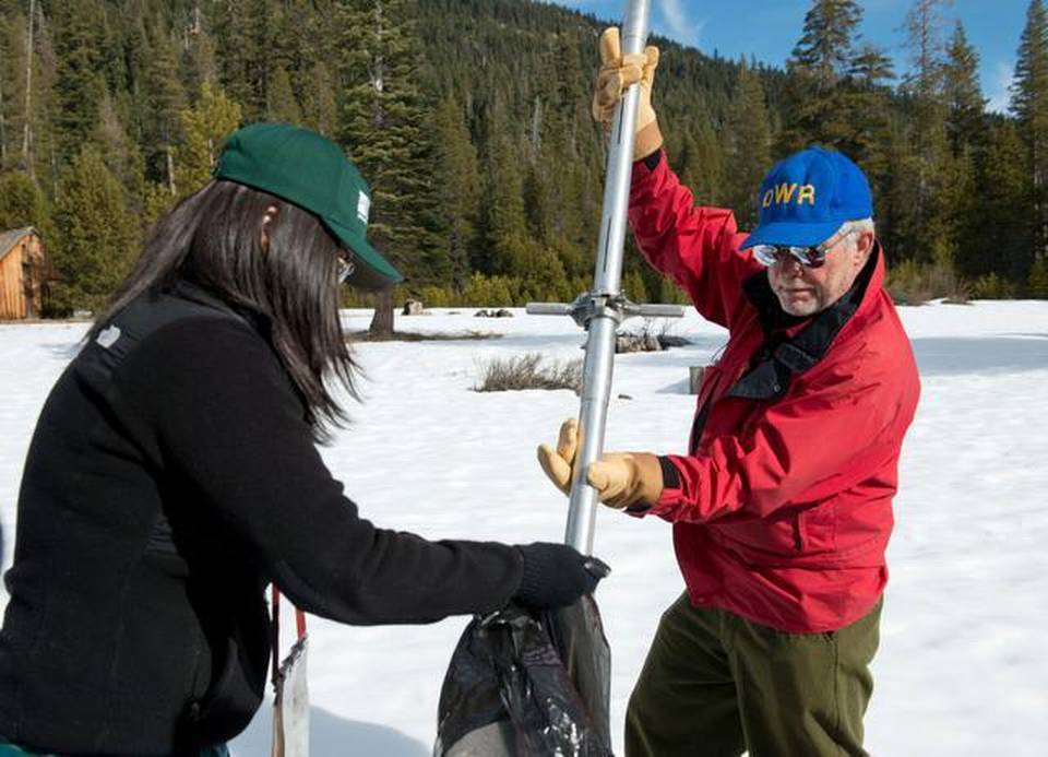Frank Gehrke, chief of California Cooperative Snow Surveys Program and Michelle Stern, with the U.S. Geological Survey, bag snow samples Thursday. RANDY PENCH RPENCH@SACBEE.COM