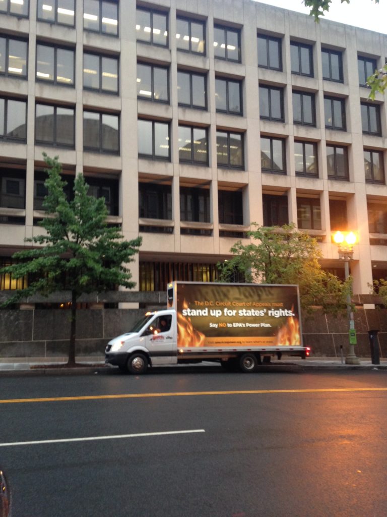 Vehicles plastered with anti-Clean Power Plan propaganda circled the courthouse.