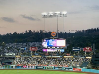 Photo of the Dodgers Stadium scoreboard showing the 76 ball advertised prominently