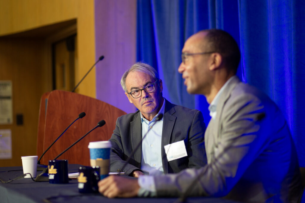 Professor William Boyd carefully listens to a panelist speak.
