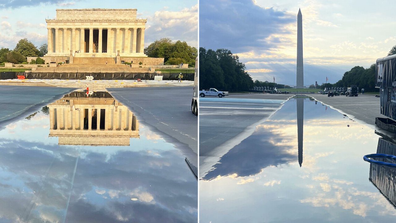 A split image shows the Lincoln Memorial and the Washington Monument reflected clearly in a large puddle on the ground, with the sky and clouds mirrored in the water.