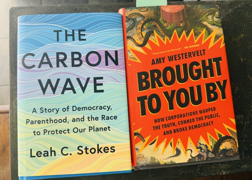 Two books side by side: The Carbon Wave by Leah C. Stokes with a blue wavy cover, and Brought to You By by Amy Westervelt with an orange cover featuring coiled tentacles.