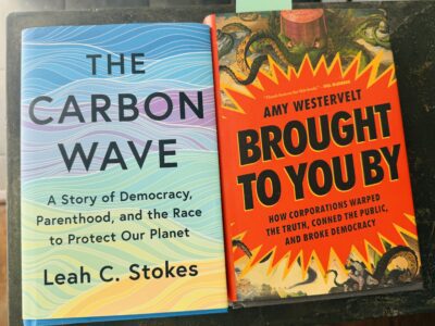 Two books side by side: The Carbon Wave by Leah C. Stokes with a blue wavy cover, and Brought to You By by Amy Westervelt with an orange cover featuring coiled tentacles.