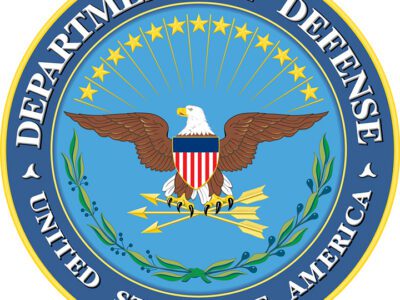 Seal of the U.S. Department of Defense featuring a bald eagle with a shield, arrows, and olive branch, surrounded by stars and a blue ring with the words Department of Defense, United States of America..